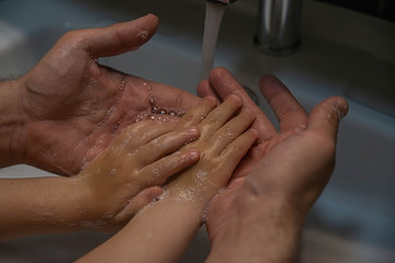 washing hands with soap.  Washing a child’s hands with soap and water to prevent coronavirus and hygiene to stop the spread of coronavirus. wash your hands with soap and hot water