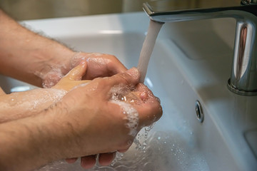 washing hands with soap.  Washing a child&rsquo;s hands with soap and water to prevent coronavirus and hygiene to stop the spread of coronavirus. wash your hands with soap and hot water