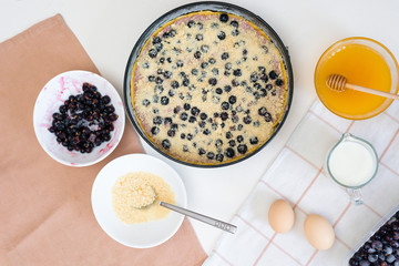 the stages of preparation of a pie with black currants and shortbread crust , fresh berries. the view from the top .