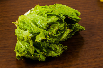 Lettuce on a wooden table. Healthy food