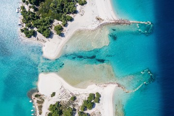 Aerial drone view of Port Glarokavos and lagoon beach in Kassandra penisula Chalkidiki Greece