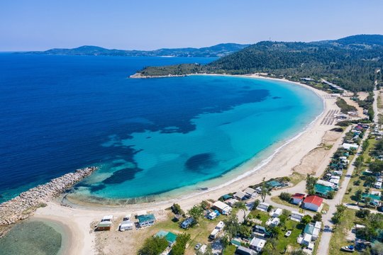 Aerial drone view of Paliouri Beach in Kassandra Sithonia penisula  Chalkidiki Greece
