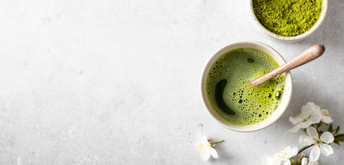 matcha green tea on a light background, top view, place for text, banner - obrazy, fototapety, plakaty
