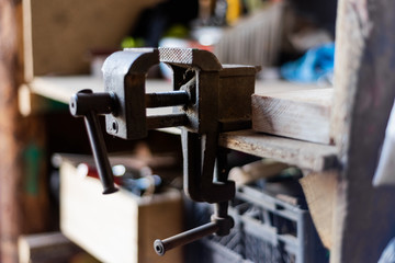 the machine is a metal press for fastening parts in the workshop