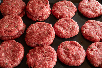 raw burgers from organic beef. top view. style vintage. selective focus