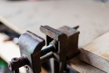 the machine is a metal press for fastening parts in the workshop