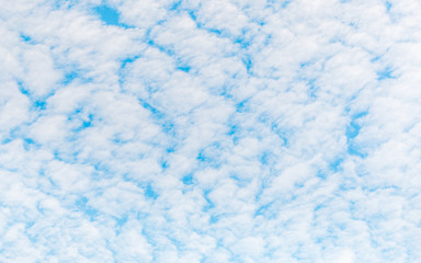 white fluffy clouds in the blue sky
