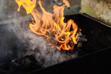 the texture of fire and smoke in the grill and on the nature