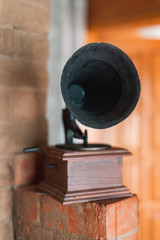 the phonograph and the old box are lying on the stove and