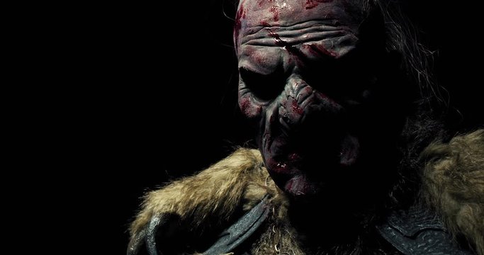 Scary dark fantasy orc with blood and cuts on his face, 4k