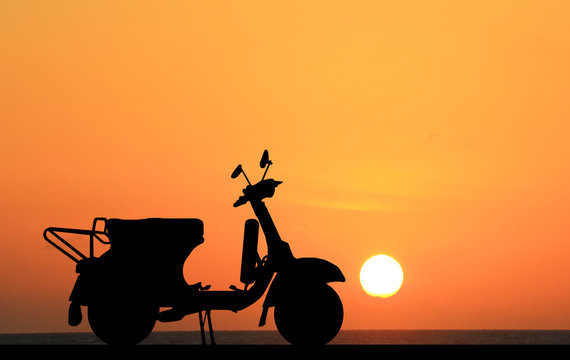 Silhouette Classic Motocycle On Sunrise Background