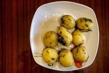 young boiled potatoes on a platter. Delicious homemade vegetable lunch
