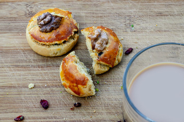 Walnut cookies and coffee with milk