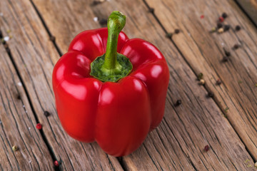 Red pepper on wooden background