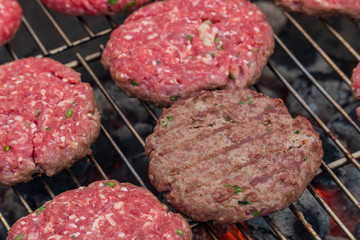 A tasty scene with Burgers cooking on the barbeque