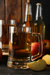 Composition with cider and apples on wooden background