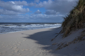 Fototapeta na wymiar Northsea coast Netherlands. Julianadorp. Beach. Breaking waves. Dunes