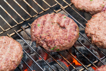BBQ Grilled Burgers Patties On The Hot Flaming Charcoal Grill, Top View. Cookout Food