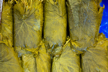 Pickled grape leaves close-up. Grape leaves for preparation of traditional oriental dishes and...