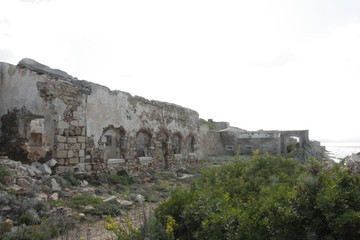 Fototapeta na wymiar Old ruins of ancient military fort of the Second Word War, Punta Rossa, Caprera, Sardinia, Italy