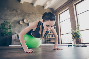 Fototapeta na wymiar Closeup photo of beautiful lady quarantine hobby training home dynamic pilates stretching practicing legs on fit ball plank push-ups exercise biceps muscles stand on arms living room indoors