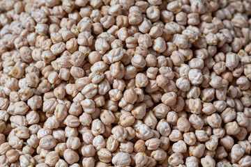 food background from a texture of raw chickpeas close-up.
