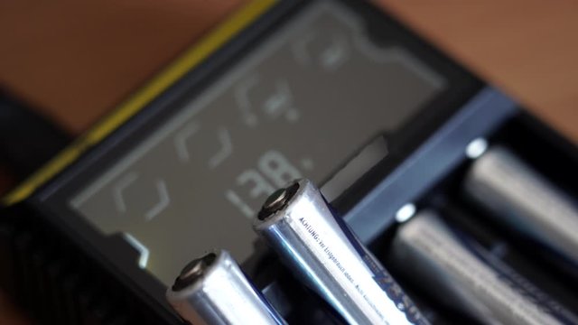 Batteries in the charger. Charge indicator.
