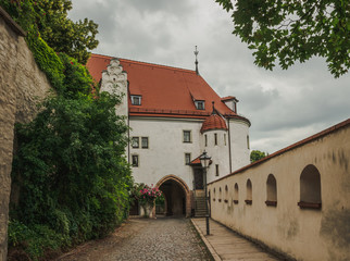 Fototapeta na wymiar Alley along the fortress wall in Altenburg castle. Germany. Soft focus, blurry background.