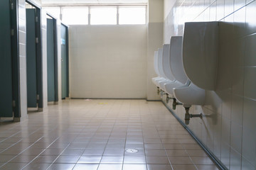 Row of clean urinal in men toilet