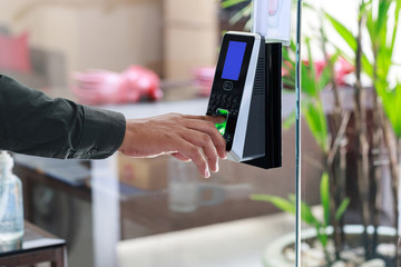 Yong man push down the electronic control machine to access the door 
