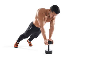 Muscular man doing push ups using dumbbell.