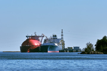 LNG tanker and carrier as floating LNG storage and import terminal in port. Alternative gas supply,...