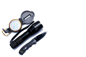 Flashlight, compass, knife, hiking tools