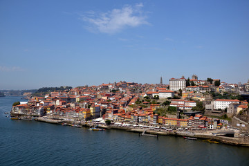 Fototapeta premium Porto, Portugal - August 20, 2015: Cityscape of Porto in summer, with a good weather. This city is built along the river Douro, which goes to the sea.
