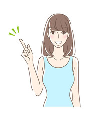 笑顔で指をさす正面向きの女性