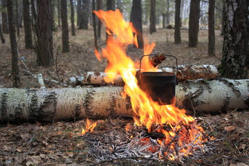 Tourist boiling pot at the stake