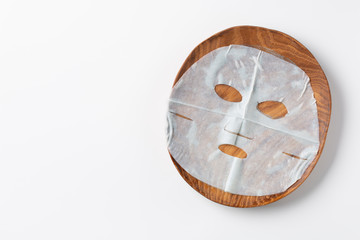 Skin care with facial sheet mask. Top view.