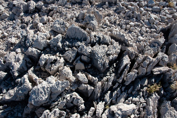 Sharp white rock stones on a sea island