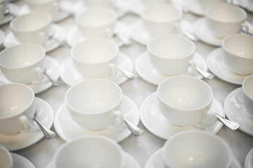 Fototapeta na wymiar Group of empty coffee cups. White cup for service tea or coffee in breakfast or buffet and seminar event or catering.