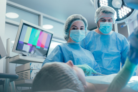 Serious surgeons in protective masks stock photo