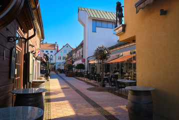 Cobbled pavements of old town streets in Klaipeda, Lithuania on sunny day. Old buildings, houses, galleries, shops, restaurants