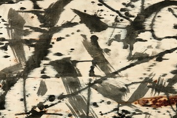 abstract grunge background, artistic painting with black paint on a light wooden background,...