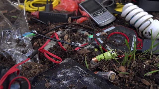 Dumping toxic ewaste (Electronic waste) in landfill. Air pollution, water pollution, soil pollution by toxic heavy metals