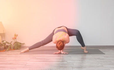 Beautiful young woman practicing yoga 