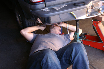 Mechanic Working on Car