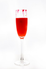colored water in a glass on a white background. bright colors contrast