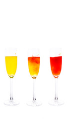 colored water in a glass on a white background. bright colors contrast