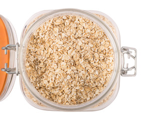 Oatmeal porridge in a crystal jar isolated on white