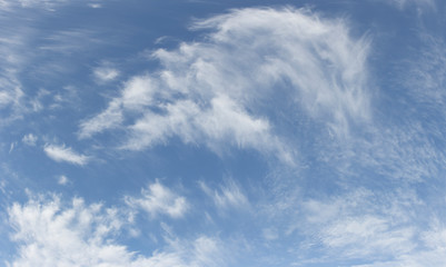 Bright blue sky with white clouds for background or wallpapers