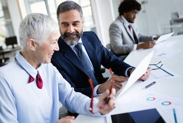 Successful team leader and business owner leading informal in-house business meeting